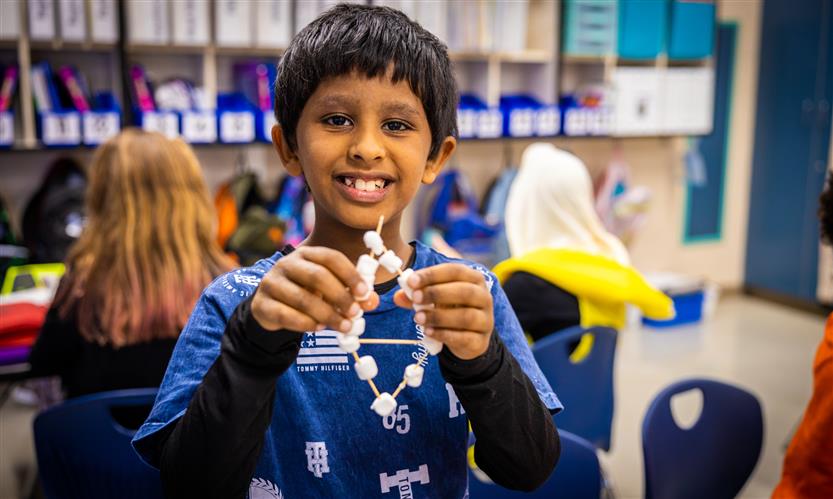 Students make constellations out of marshmallows and toothpicks